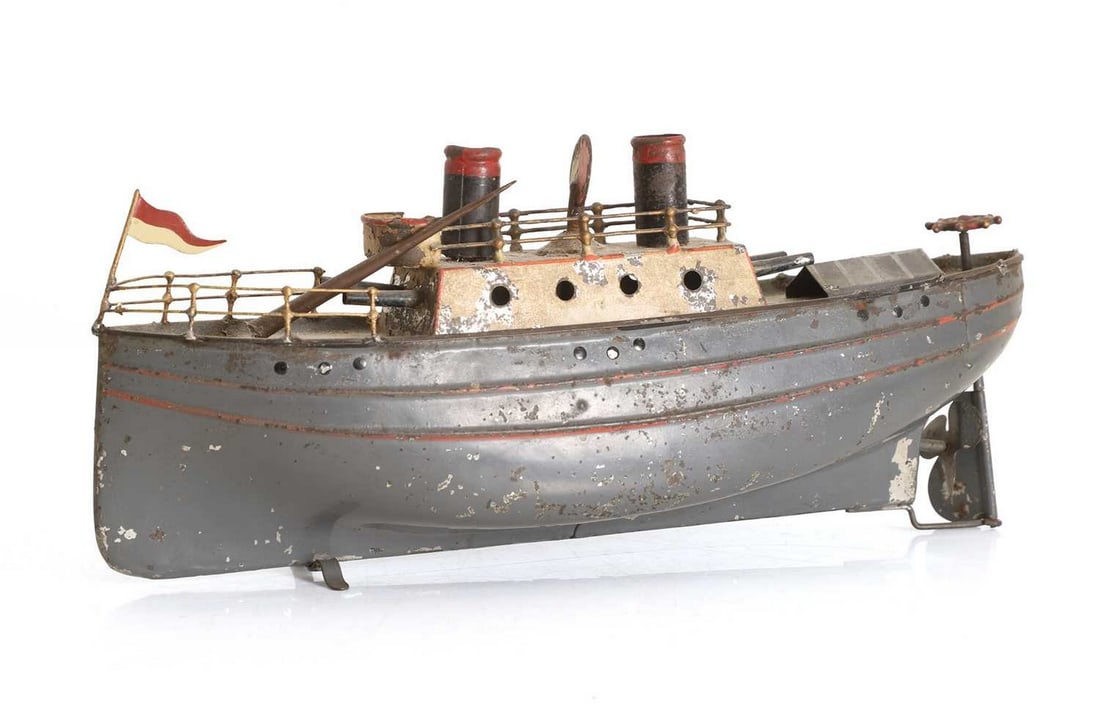 A tin model gunboat with twin chimneys, c.1920s, (1 of 2)