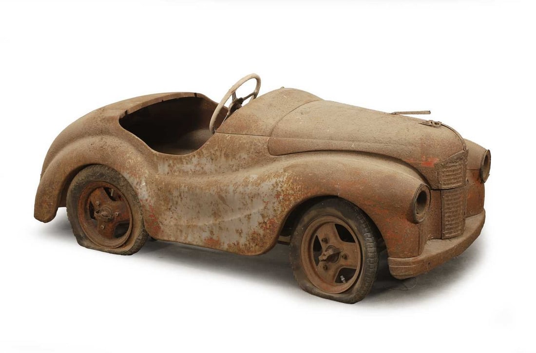 A 1949 Austin J40 pedal car,: A 1949 Austin J40 pedal car, Chassis Number: JR 1454 Presented as a restoration project, this example is shown in records as the last J40 built in 1949, making it both very early and highly significan