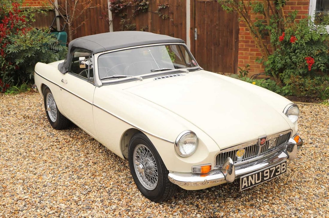 A 1964 MGB GT Roadster,: A 1964 MGB GT Roadster, Registration Number: ANU 973B Engine Number: 18GBUH 85668 Chassis Number: GHN339661 Odometer Reading: 11,130 Finished in white, with a black on black piped interior and roof, t