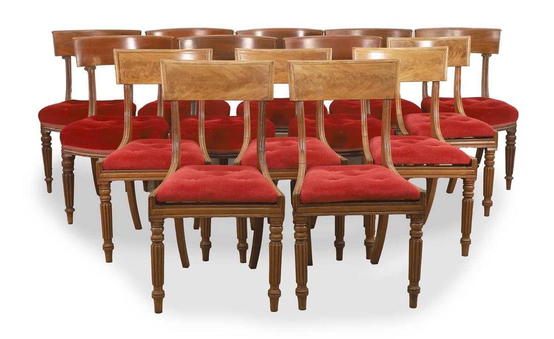 A composed set of fourteen mahogany bar back chairs, 19th century,: A composed set of fourteen mahogany bar back chairs, 19th century, comprising a set of eight and six, all upholstered in red velour fabric with braiding and on turned reeded legs 51cm wide, 50cm