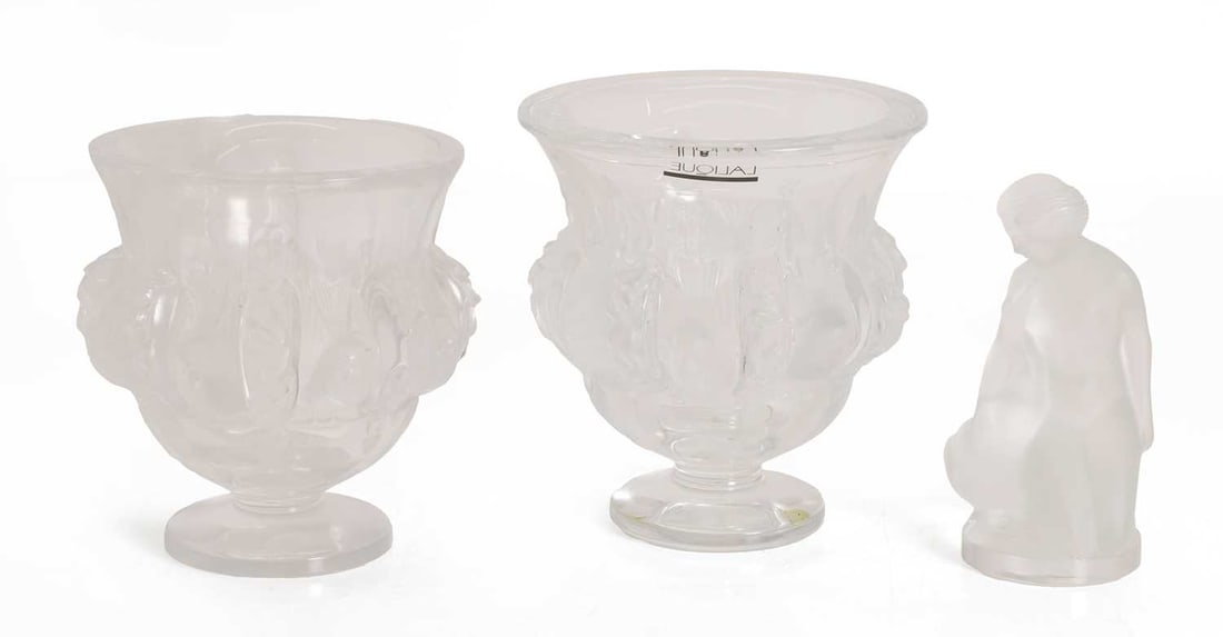 Three Lalique glass items, of recent manufacture, French: Three Lalique glass items, of recent manufacture, French comprising a pair of 'Dampierre' vases and a figure of Leda, signed vases 12.7 and 12cm high, leda 11.5cm high 3 Condition Report: Some water