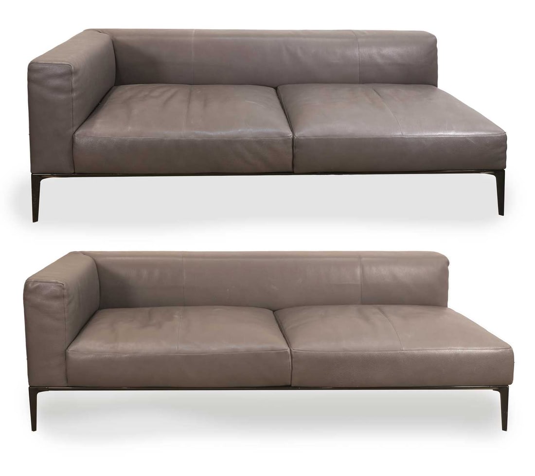 Walter Knoll, a corner sofa, of modern manufacture,: Walter Knoll, a corner sofa, of modern manufacture, upholstered in grey leather with black cast metal frame and legs, in two sections Each section, 206cm wide, 92cm deep, 69cm high and 226cm wide, 92c