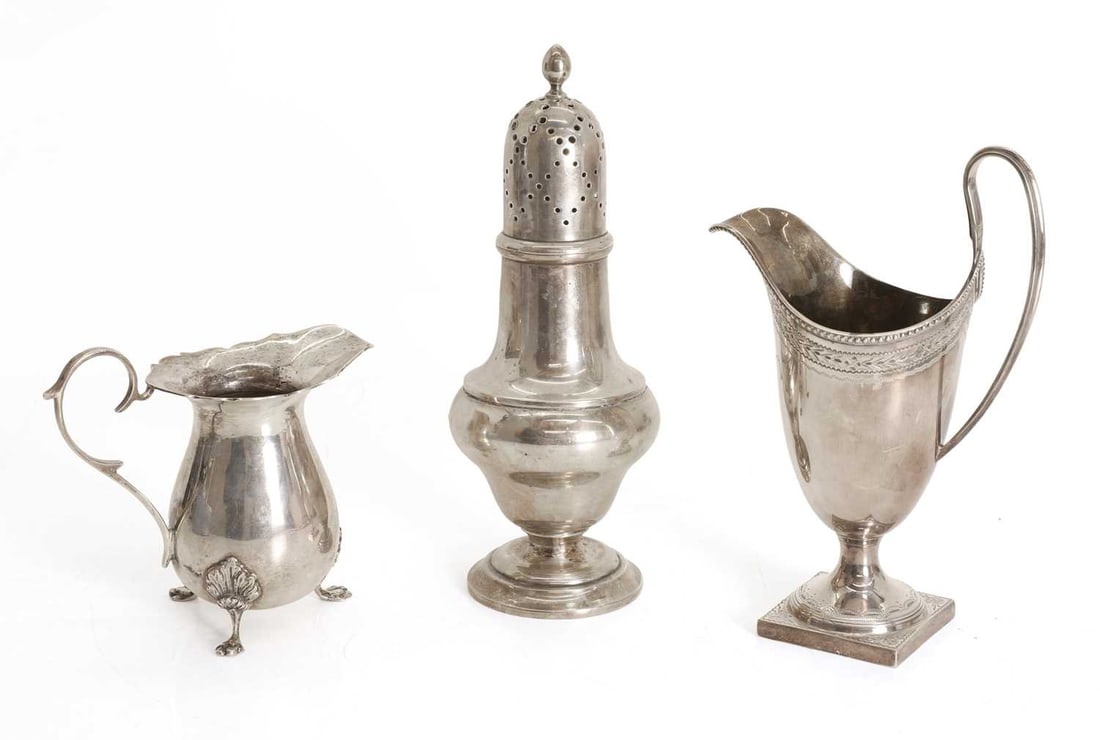 A collection of three silver items,: A collection of three silver items, to include a helmet jug by C J Vander Ltd, London, 1973, decorated with a floral design and with a beaded rim, a sugar sifter by Cornelius Desormeaux Saunders