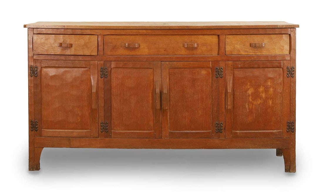 A Yorkshire School sideboard, late 20th century, by Robert 'Kingpost' Ingham,: A Yorkshire School sideboard, late 20th century, by Robert 'Kingpost' Ingham, with panelled sides, three drawers, over three cupboards, signed with a triangular 'Kingpost' motif 160cm wide, 49cm