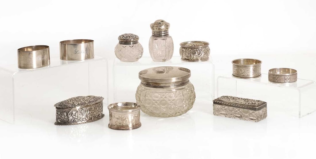A group of silver items,: A group of silver items, comprising a pair of napkin rings, by Hukin & Heath Ltd, Birmingham, 1943, inscribed 'Ruth' and 'Bob', another with repousse decoration by Minshull & Latimer,