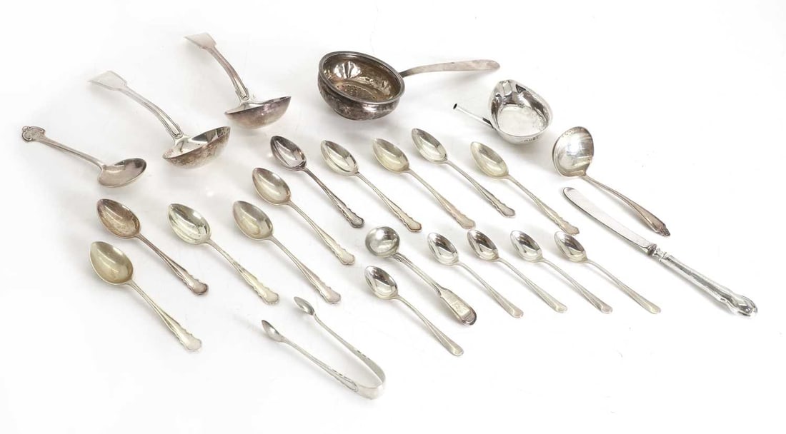 A collection of silver flatware,: A collection of silver flatware, to include two sauce ladles by William Cripps, London,1823, with banded fiddle pattern decoration, a set of ten teaspoons by William Hutton & Sons Ltd, Sheffield,