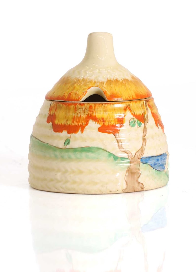 A Clarice Cliff 'Taromina Orange' honey pot and cover, circa 1936, (1 of 2)