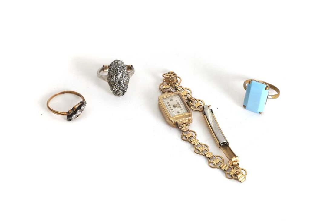 An 18ct gold ring,: An 18ct gold ring, mounted with stones, one missing, together with a silver ring with 9ct gold re sizer, and a 12ct rolled gold ladies wristwatch 3cm
