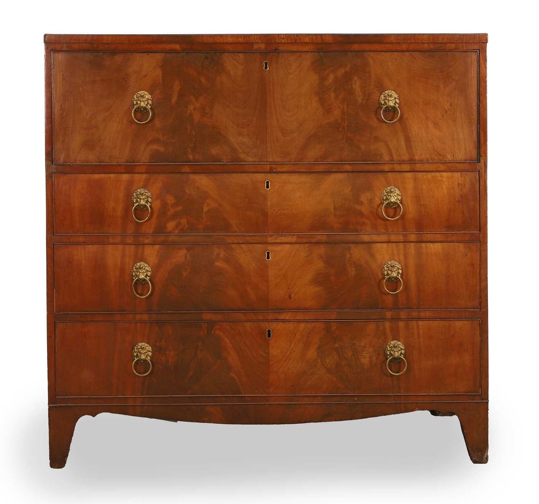 A Regency mahogany secretaire bookcase base, circa 1800,: A Regency mahogany secretaire bookcase base, circa 1800, the rectangular top above a fitted secretaire drawer enclosing an arrangement of pigeon holes and drawers, with a red leather writing surface,