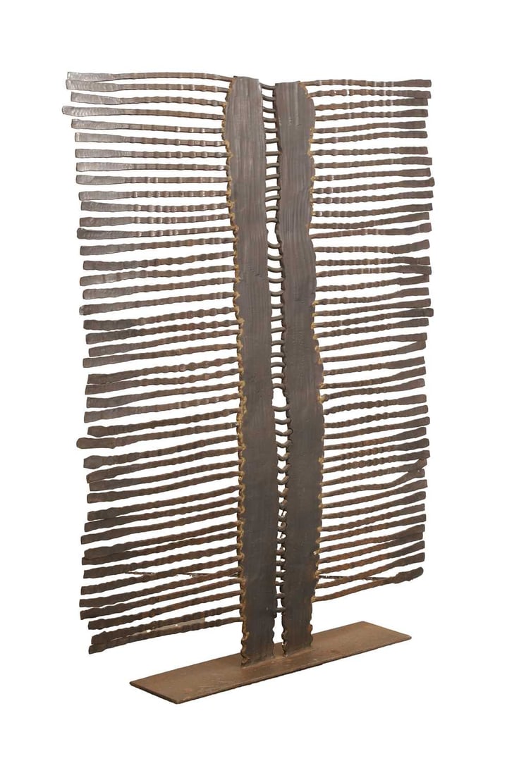 A contemporary metal fire screen of tribal influence, - 2