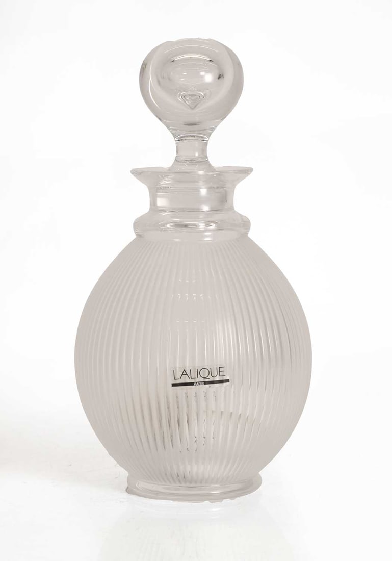 A Lalique 'Langeais’ decanter, of recent manufacture, French,: A Lalique 'Langeais’ decanter, of recent manufacture, French, moulded and frosted glass, signed and labelled 12cm diameter, 25cm high Condition Report: In good order with minor signs of use.