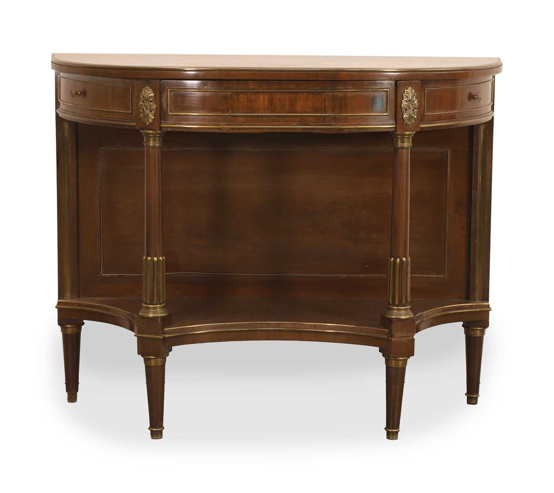 A French Empire-style demilune table, 20th century,: A French Empire-style demilune table, 20th century, decorated with metal mounts, with two opposing drawers, with a shaped undertier 102cm wide, 42.5cm, 81.5cm high Condition Report: Only one drawer