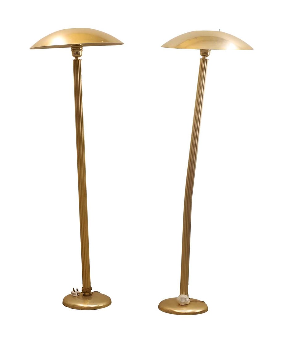 A pair of Art Deco-style uplighters, 20th century,: A pair of Art Deco-style uplighters, 20th century, each with shallow silvered shades, the collar mounts with lucite rods, reeded supports 55.5cm wide, 180cm high 4 Condition Report: Knocked and bent.