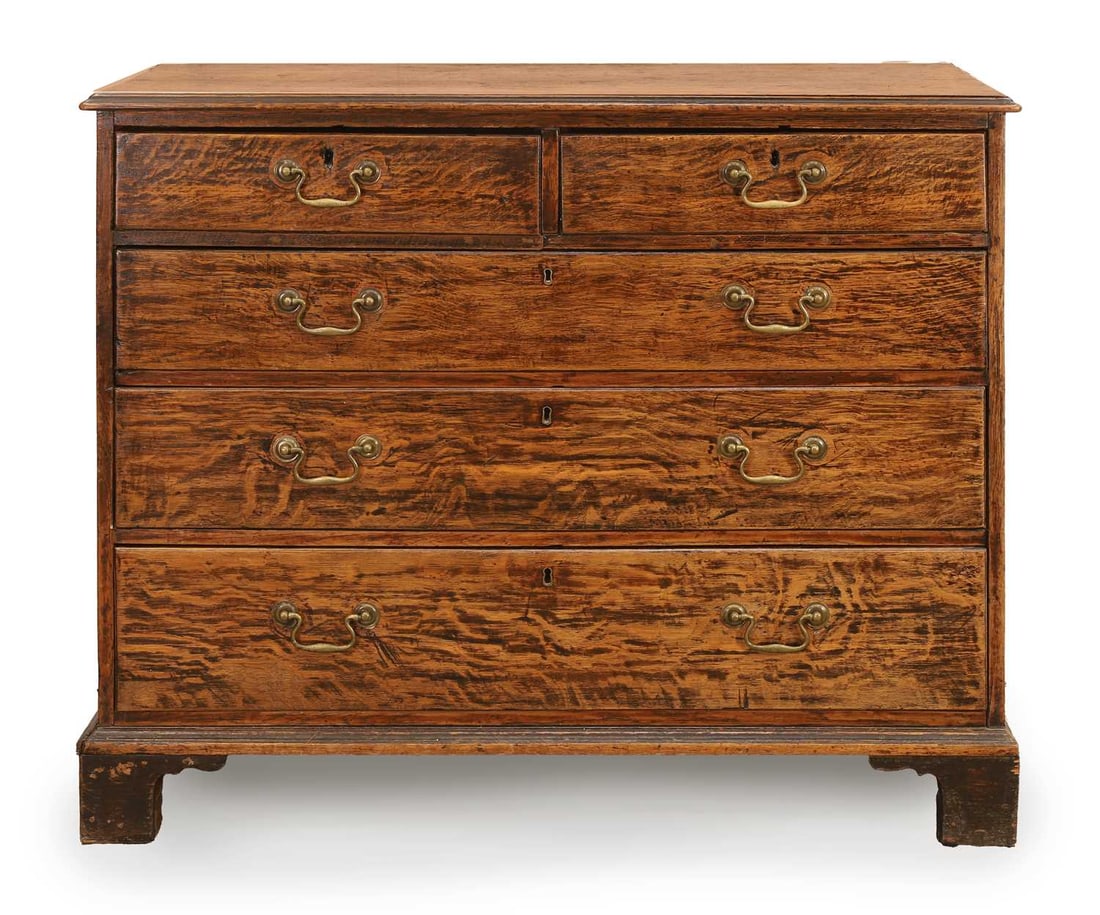 A George III 'tiger' oak chest of drawers, third quarter 18th century, (1 of 2)