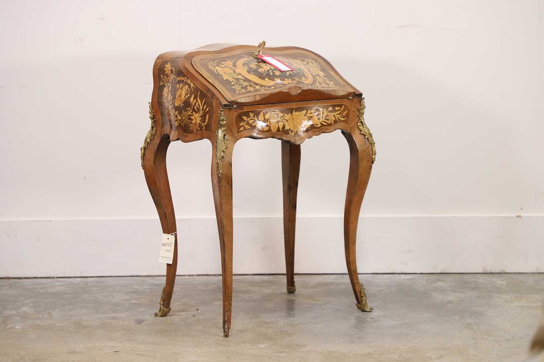A Louis XV-style tulipwood, kingwood and marquetry bureau de dame, 19th century,: A Louis XV-style tulipwood, kingwood and marquetry bureau de dame, 19th century, of serpentine form, the fall front enclosing a fitted interior with three short drawers above a writing surface inset w