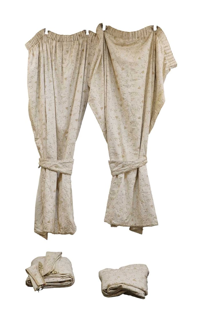 Two pairs of cream and embroidered curtains, of recent manufacture, (1 of 2)