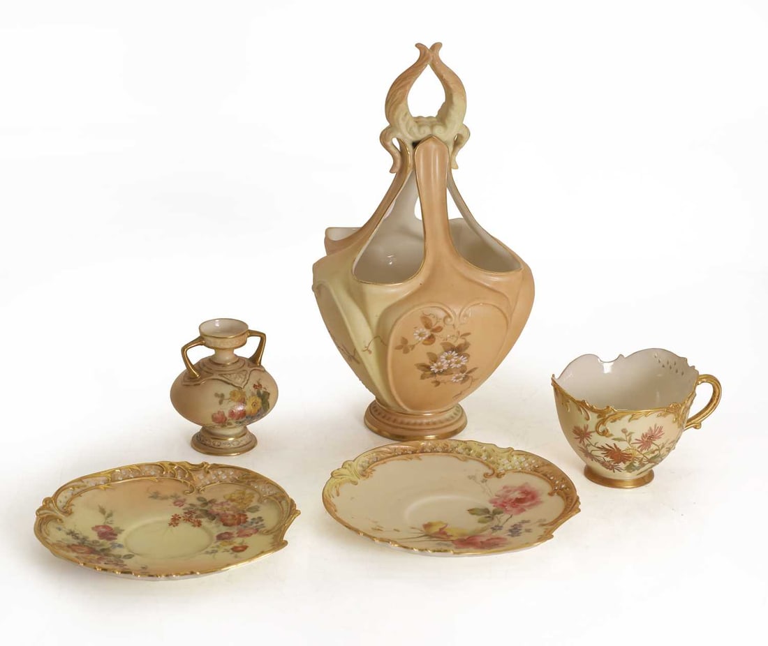 A collection of Royal Worcester blush porcelain, late 19th century,: A collection of Royal Worcester blush porcelain, late 19th century, to include a hankerchief-style vase, a teacup, a miniature two-handle urn, and two saucers, all with a blush ivory ground decorated