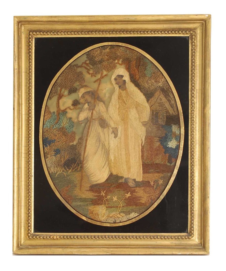 A silk and needlework panel,: A silk and needlework panel, framed in an egloimise frame, depicting two females and a cottage in the woods framed, 44 x 35.5cm Condition Report: Some tearing to the silk, and fading to the colour