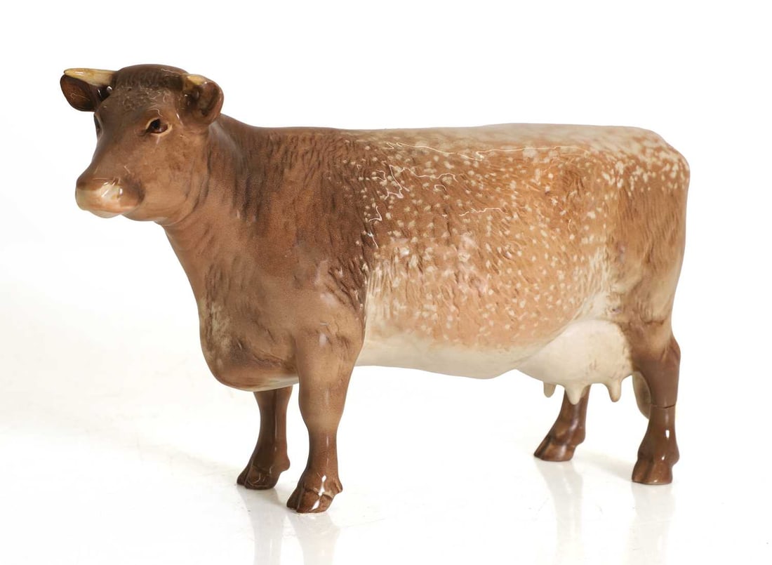 A Beswick shorthorn cow, 20th century,: A Beswick shorthorn cow, 20th century, 'CH Eaton Wild Eyes 91st', model No. 1510, brown and cream shading 20cm long, 12cm high Condition Report: Previous repair to leg, and leg is now detached.