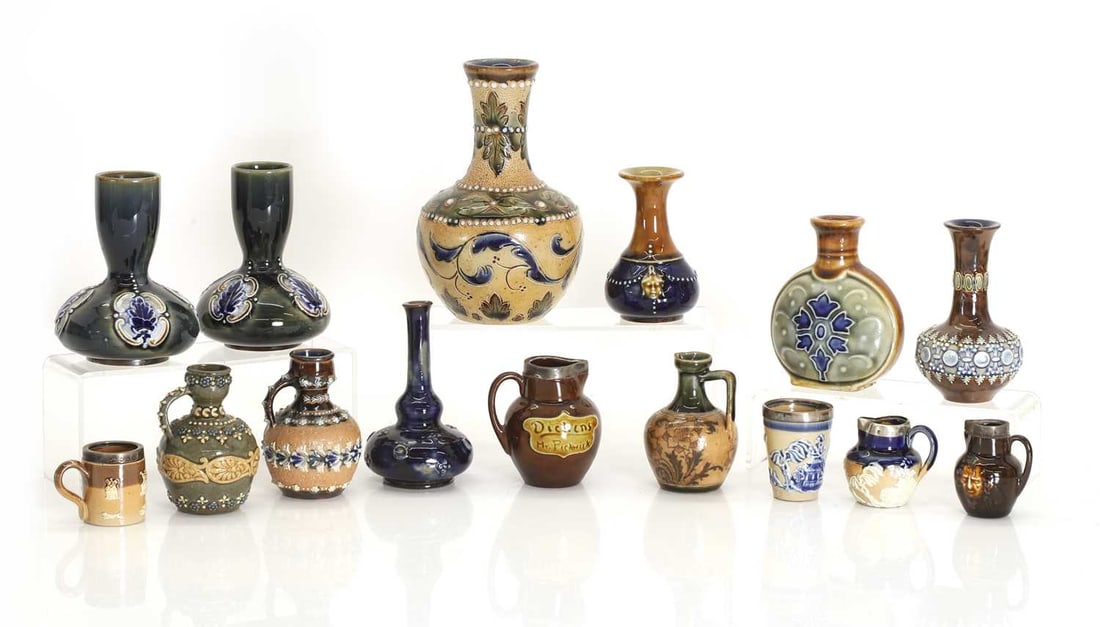 A collection of miniature stoneware items,: A collection of miniature stoneware items, to include a Fulham pottery vase with a beige ground decorated with foliate banding, and a collection of Doulton, including three miniature jugs, a tankard, 