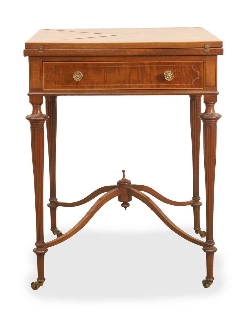 An Edwardian inlaid mahogany envelope card table, circa early 20th century,: An Edwardian inlaid mahogany envelope card table, circa early 20th century, with a baized mounted surface and dished wells, over a single drawer, labelled, 'Heelas Ltd, Reading', on fine turned and