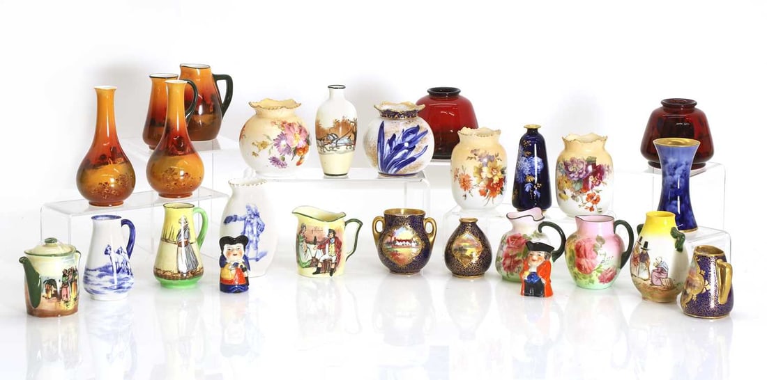 A large collection of Doulton miniatures, (1 of 3)