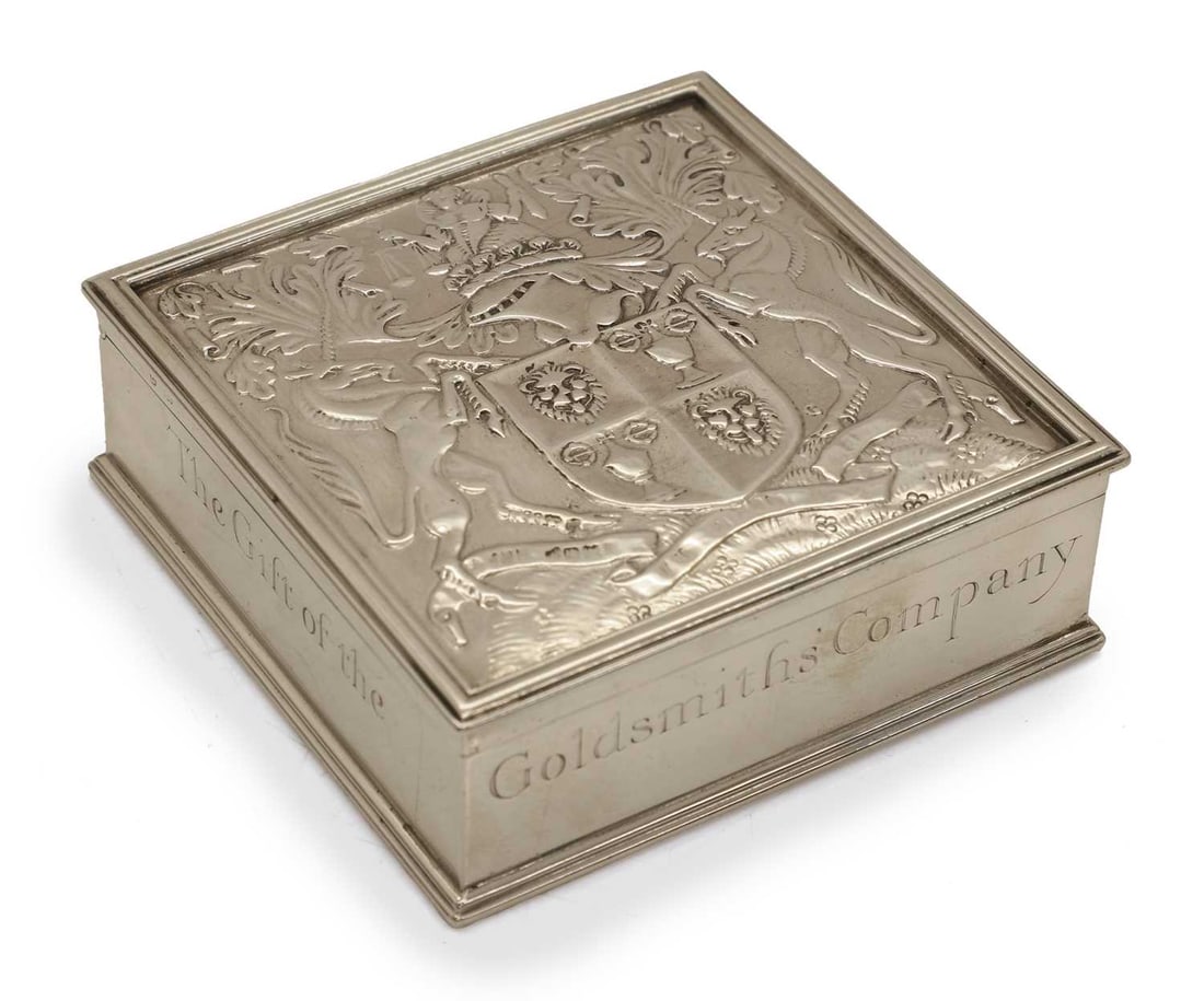A silver lidded matchbox,: A silver lidded matchbox, by Garrard & Co Ltd, London, 1926, with coat of arms of the Goldsmiths to the top, and inscribed 'The Gift of the Goldsmiths' Company A.D.1327-1927', with white metal str