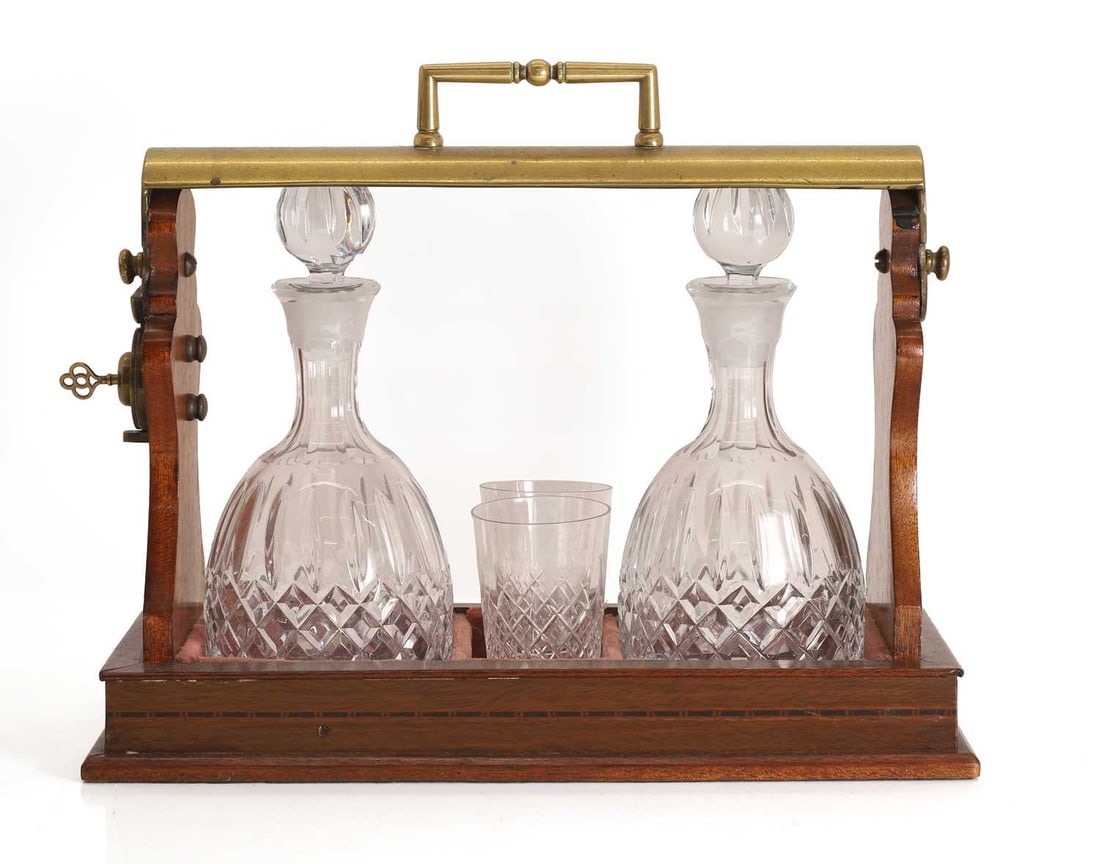 A mahogany and brass tantulus, 20th century, - 2