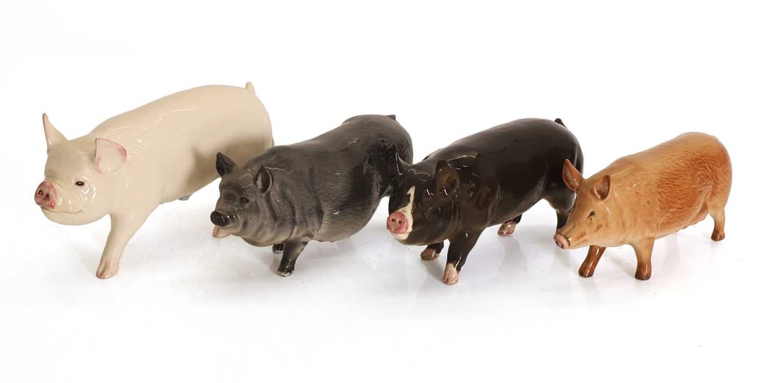 A collection of Beswick pigs and a boars, 20th century, (1 of 2)