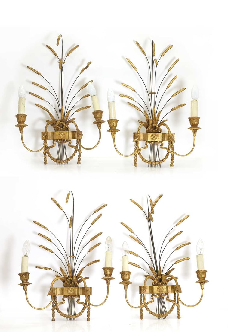 A set of four gilt composition wall lights, mid-20th century,: A set of four gilt composition wall lights, mid-20th century, each with two scrolled branches below arching wheatsheafs 63cm high 4