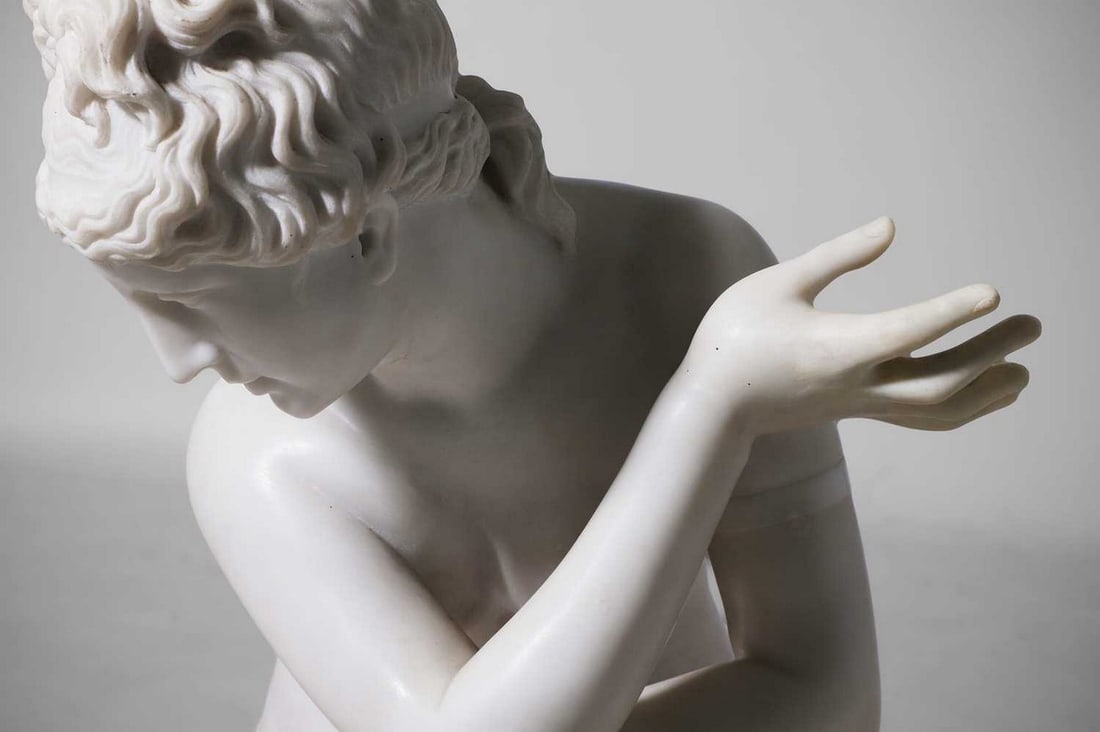 A large marble figure of 'The Crouching Venus', 20th century, Italian, after the antique, (1 of 8)