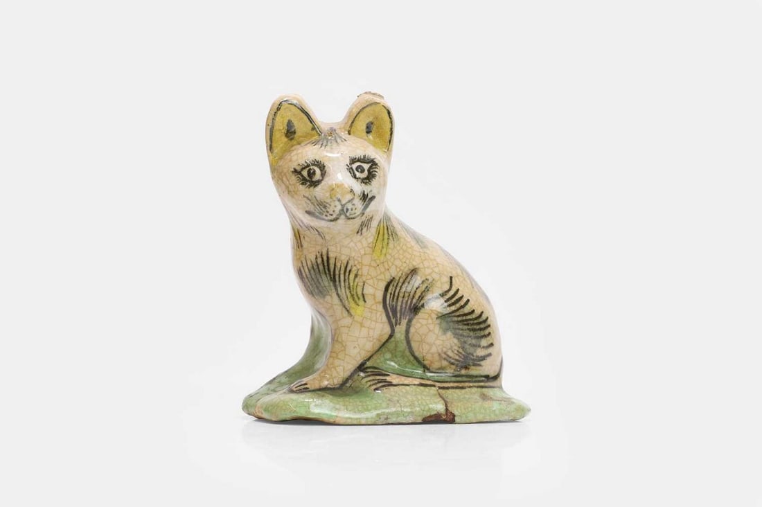 A glazed pottery figure of a cat, probably Persian, Qajar dynasty, (1 of 3)