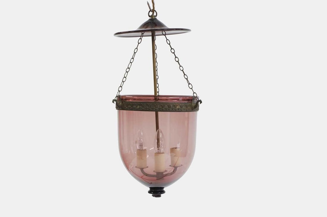 A George III-style ceiling lantern, of recent manufacture,: A George III-style ceiling lantern, of recent manufacture, with a domed amethyst glass shade, the arms issuing three sconces, fitted for electricity (26cm diameter, 57cm high, 109cm high fully outstre