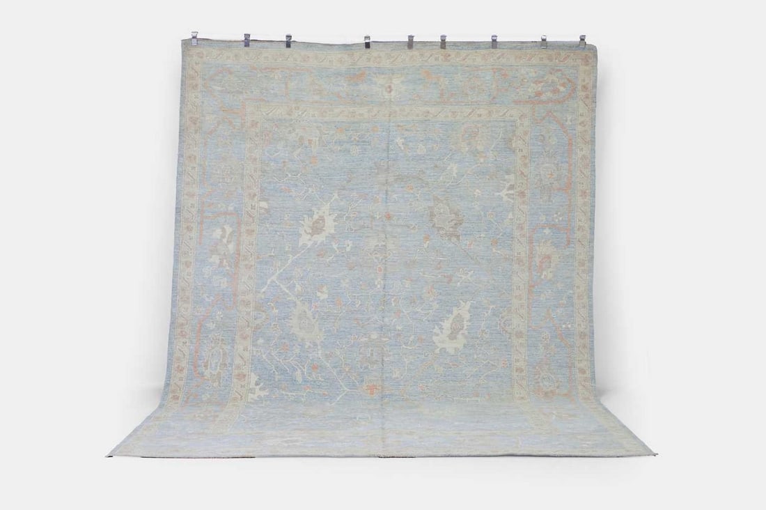 An Oushak wool carpet, of recent manufacture, (1 of 3)