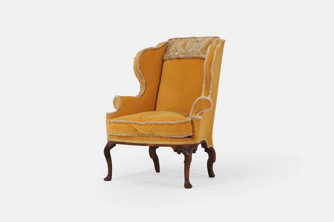 A George I upholstered wing armchair, circa 1720, (1 of 3)