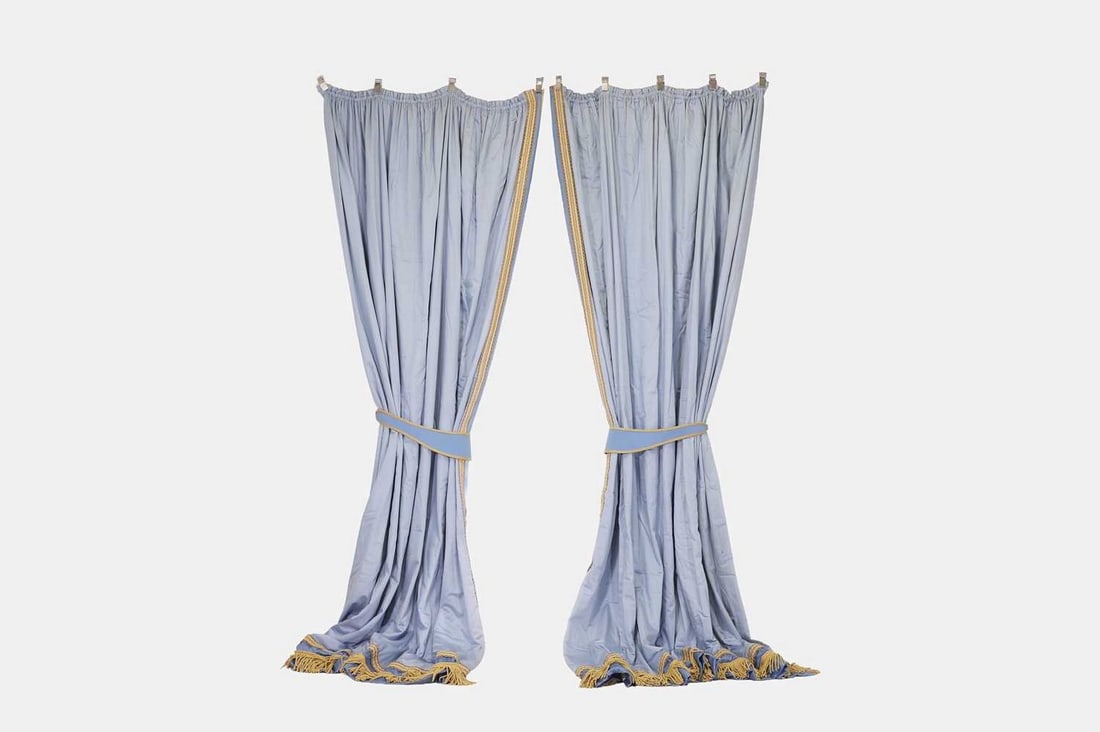 Three pairs of blue silk curtains, of recent manufacture,: Three pairs of blue silk curtains, of recent manufacture, in the French taste, lined and interlined, the light-blue field with darker blue border, gold braided trim and fringing, with tie-backs and pe