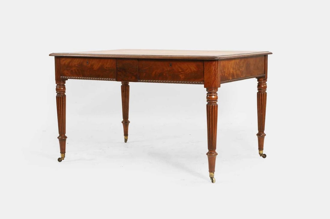 A George IV mahogany writing table, circa 1825, in the manner of Gillows, (1 of 4)