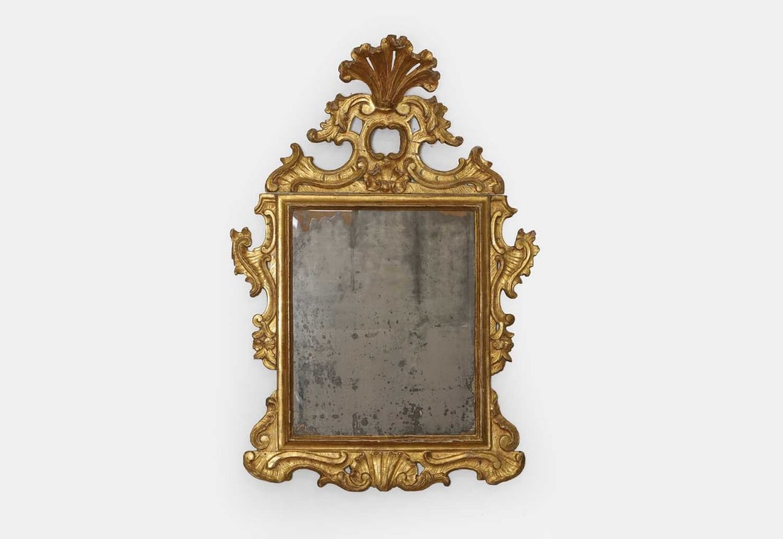A rococo giltwood wall mirror, mid-18th century, French or Italian, (1 of 3)