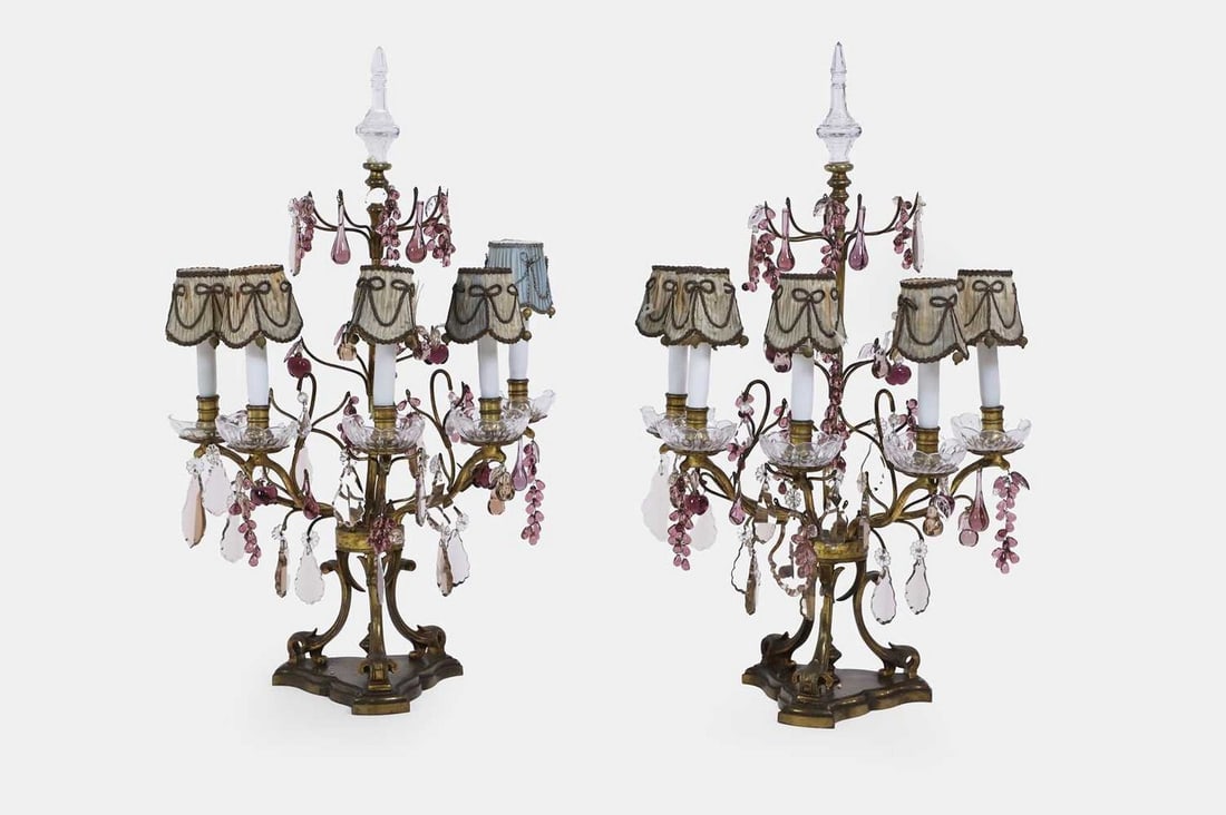 A pair of gilt-brass, clear glass and amethyst glass table lamps, early 20th century, French,: A pair of gilt-brass, clear glass and amethyst glass table lamps, early 20th century, French, each slender column surmounted by a knopped glass finial, with five scrolling branches suspending numerous
