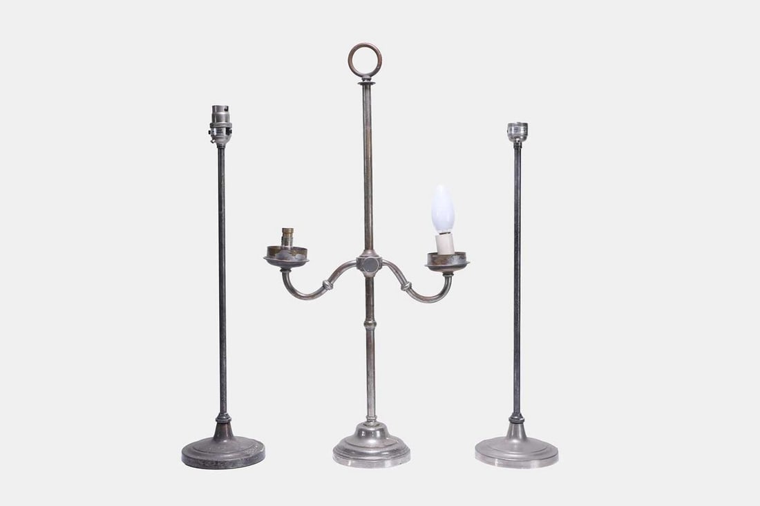 A set of three white-metal table lamps, 20th century, (1 of 4)