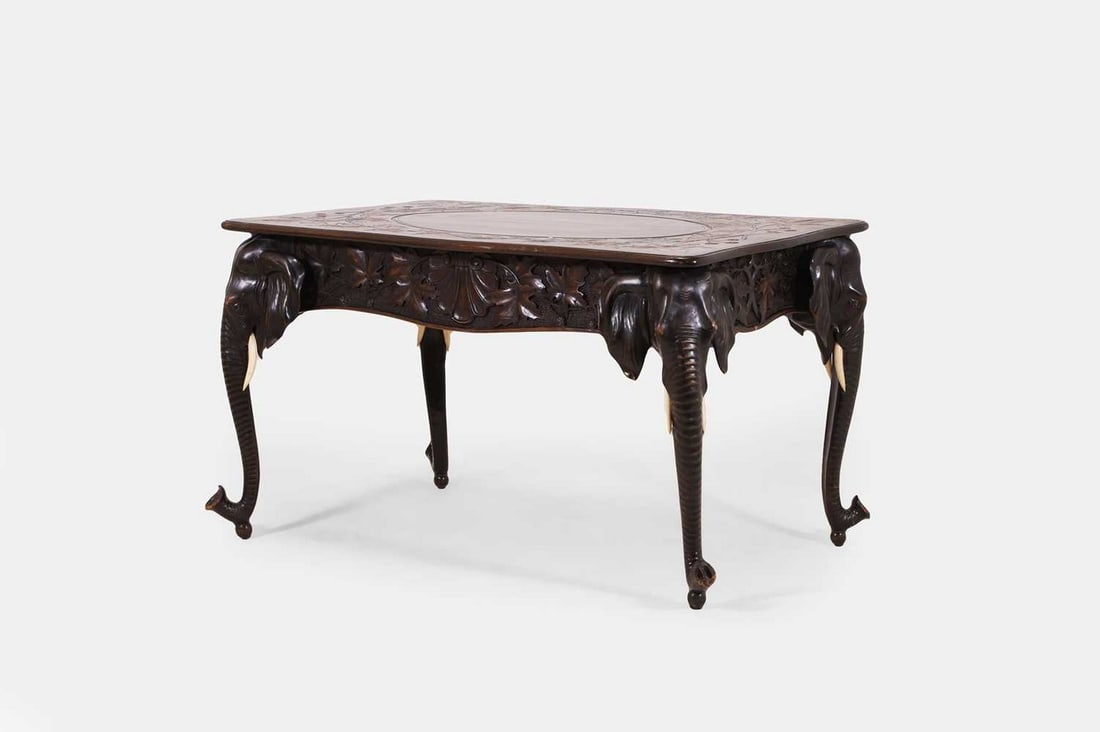 A Black Forest ivory and carved wood 'elephant' centre table, late 19th/early 20th century, Swiss, (1 of 3)