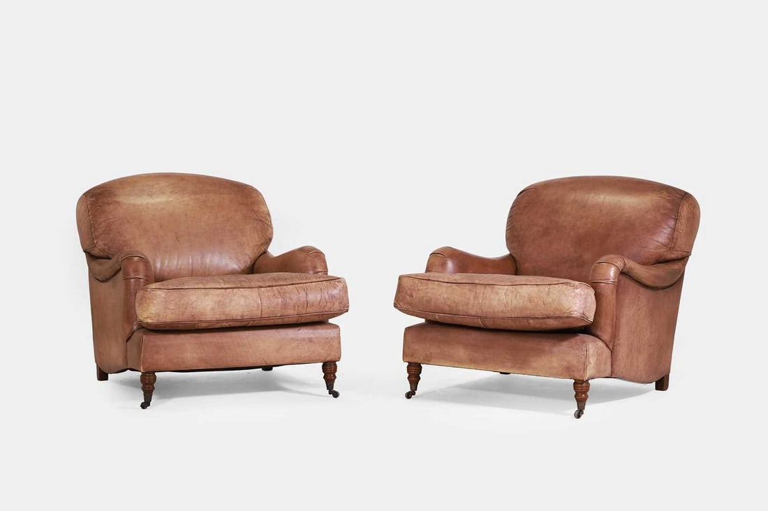 A pair of leather armchairs, of recent manufacture, in the style of George Smith, (1 of 4)
