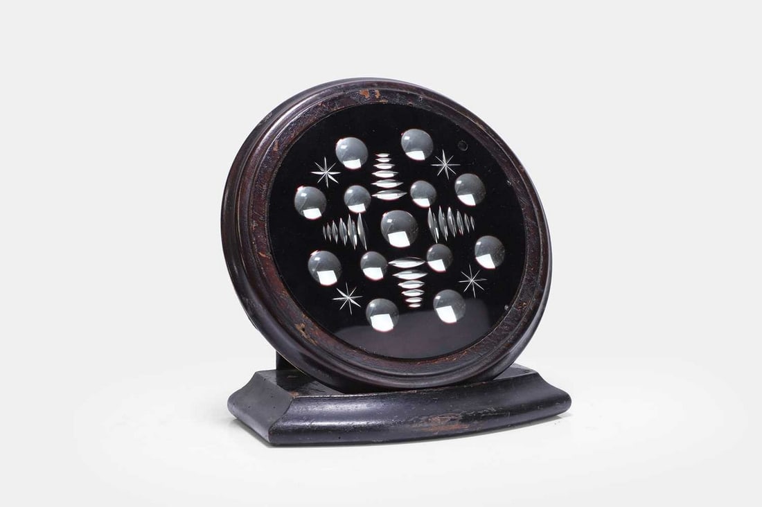 A ruby-red sorcerer's mirror, late 19th/early 20th century, (1 of 3)
