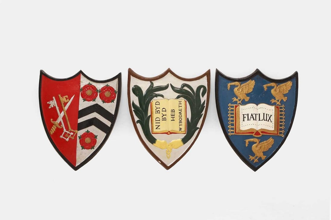 Three painted wood armorial shields, early 20th century, (1 of 3)