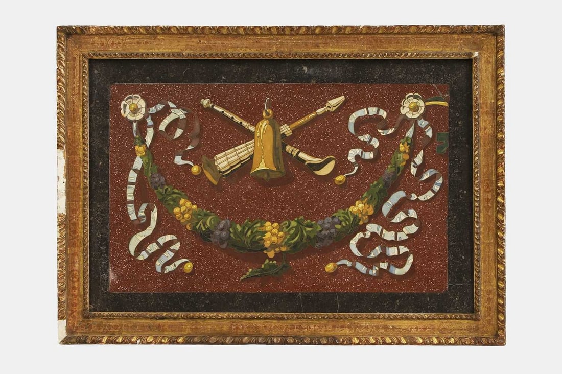 A large scagliola panel, 19th century, Italian,: A large scagliola panel, 19th century, Italian, depicting a bell, musical trophies, fruiting swag and ribbons, with brass inlay on a simulated porphyry ground, within a carved giltwood frame (panel 44