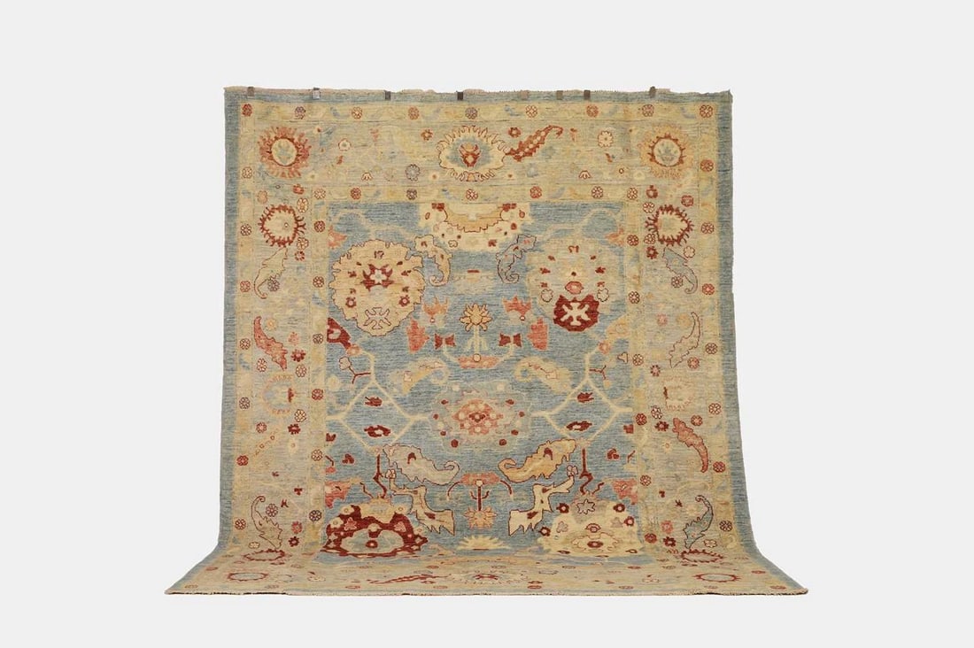 An Oushak wool carpet, of recent manufacture, (1 of 3)