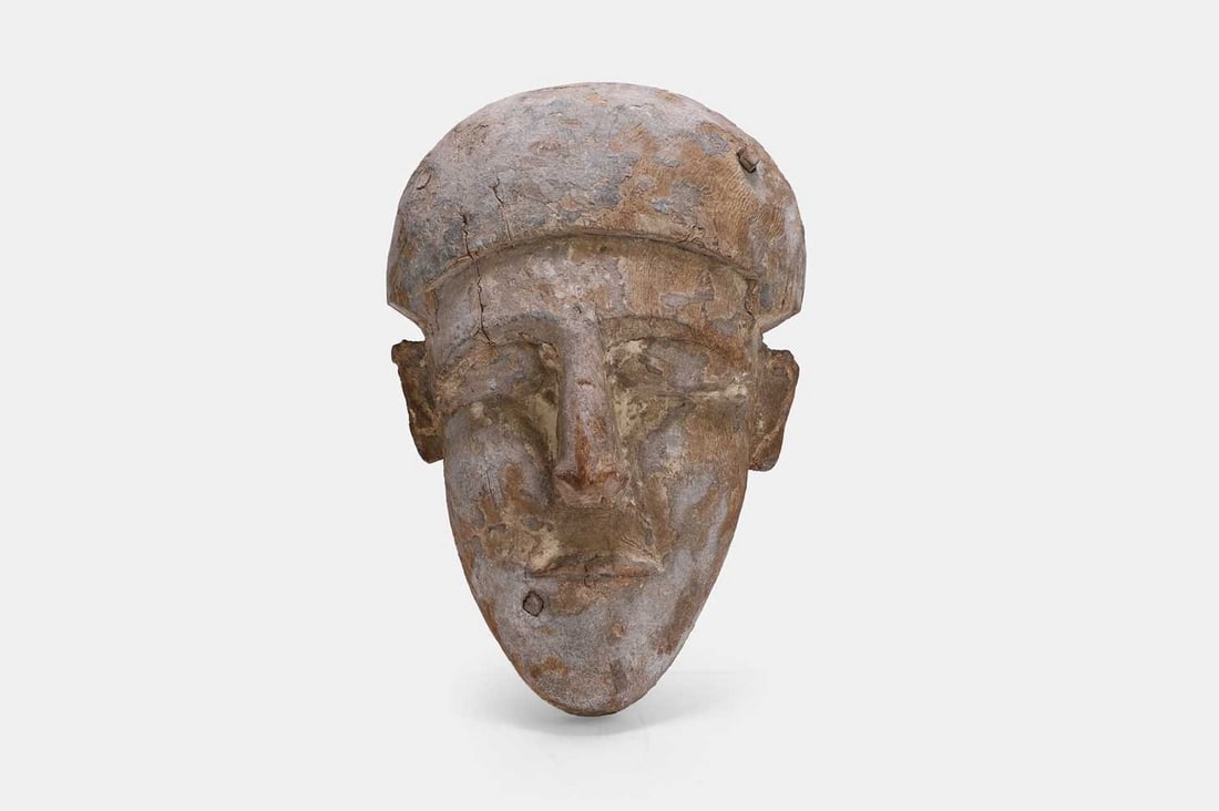 An Ancient Egyptian carved cedar sarcophagus mask, Late Period, circa 664-332 BCE, (1 of 3)
