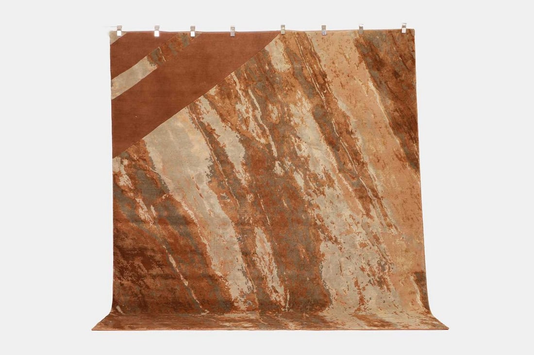 A Sahrai Milano 'Copper Dune' wool and silk relief rug, of recent manufacture,: A Sahrai Milano 'Copper Dune' wool and silk relief rug, of recent manufacture, woven primarily in shades of red, pink and grey (300 x 250cm) Condition Report: Very good condition overall. Light genera