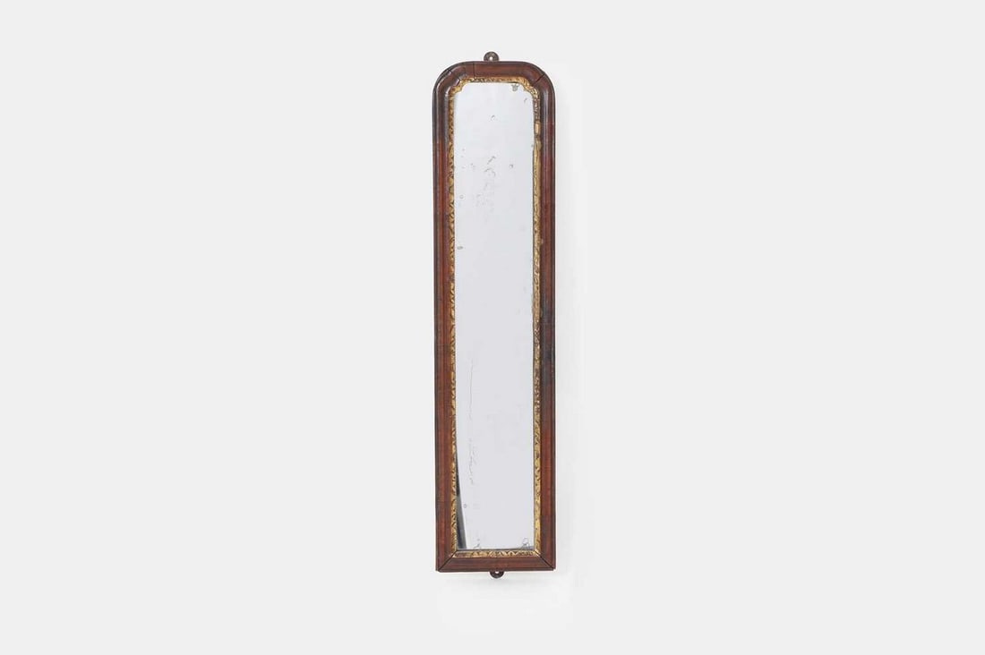 A walnut and parcel-gilt pier glass, first quarter of the 18th century, (1 of 3)
