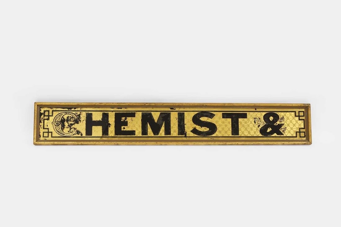 A verre églomisé chemist's sign, late 19th/early 20th century, (1 of 2)